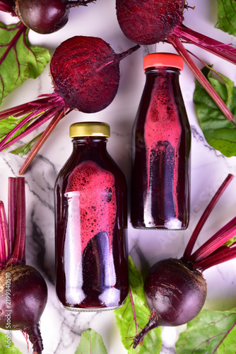 Healthy fresh beetroot juice on a white background. Flat lay.
