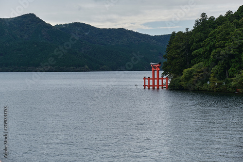 A Japanese Shinto shrine gate also known as a Torii on Lake Ashi