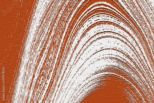 Abstract textured background with curved white lines on orange surface during close-up study