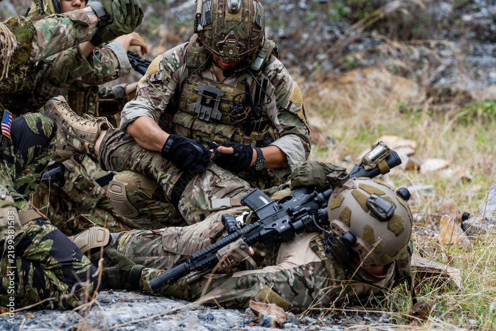 Fototapeta premium Military personnel engage in training exercise in outdoor setting during daytime