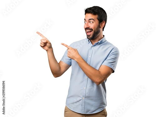 Excited man in a blue shirt pointing towards the left with his fingers