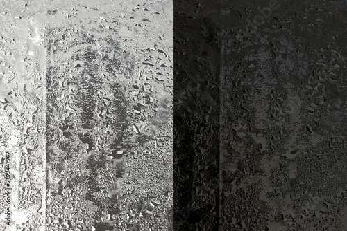 Obraz na płótnie Black and white split screen surface with wet water droplets showing sharp contr