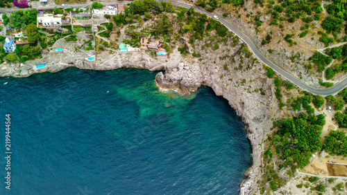 Drone view of curving coastal road on Amalfi Coast with sea views