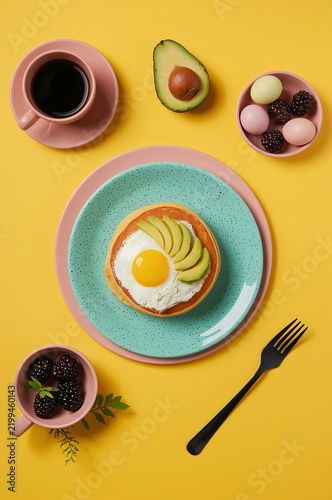 Breakfast Plate With Avocado and Egg on Yellow Table