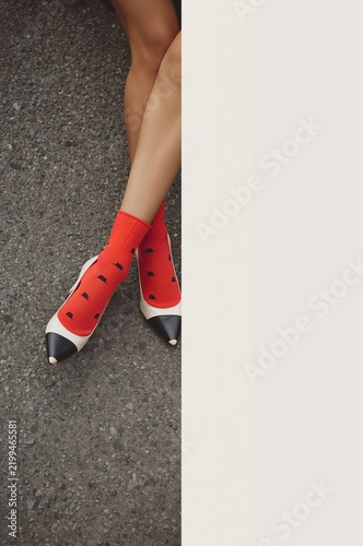 Footwear and Socks on Asphalt Surface in Urban Setting