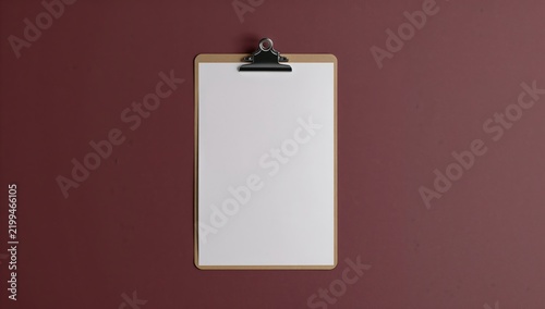 Blank Clipboard on a Brown Wall Ready for Notes or Drawings