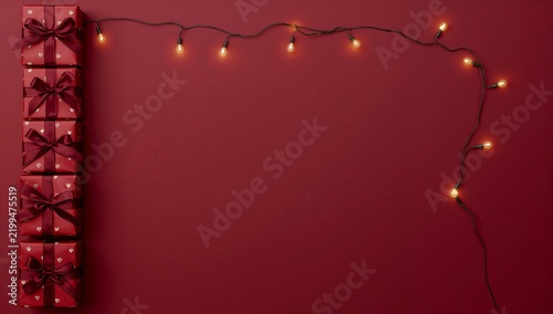 Decorated Gifts and String Lights on a Red Background
