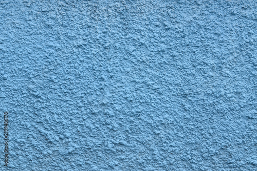 blue rough stucco wall texture, stucco wall with uneven bumpy surface finish, architectural design background
