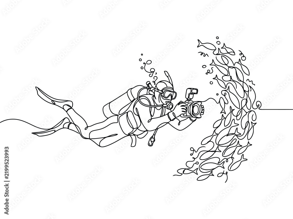 Obraz premium A diver films a school of fish underwater with a camera while exploring the ocean depths