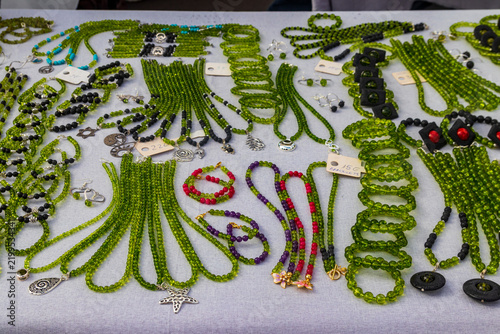 Konstfotografi Assortment of traditional Canarian volcanic jewelry made from green olivine and