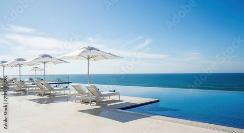 Luxury Infinity Pool Overlooking The Vast Ocean Horizon