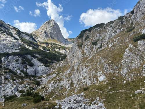 Dramatic limestone peak in a mountain valley