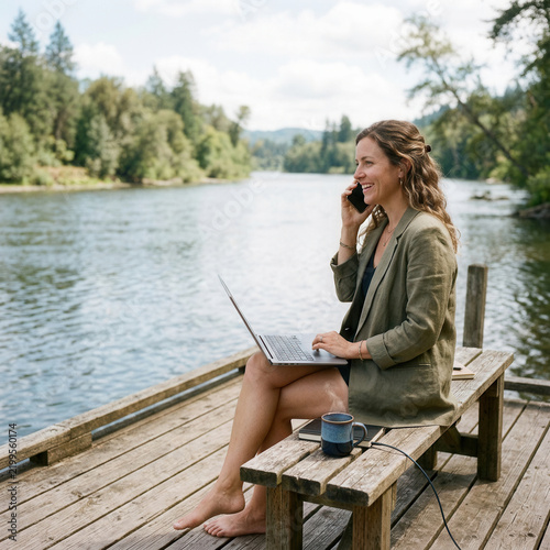 Remote Work Bliss A Woman Working Outdoors By A Serene River