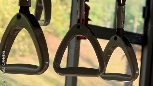 A close-up of a pair of handles on a bus, ideal for travel or transportation-themed projects