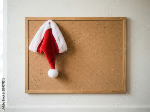 Festive Santa Hat Adorns Cork Board Ready For Holiday Notes