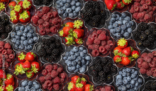 Mixed Berries Arranged In A Flat Lay On A Dark Background. Blueberries Blackberries Raspberries And Strawberries Top View. Rich Fruit Pattern