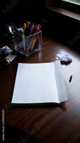 Tapety artystyczne Empty Graph Paper on Dark Desk