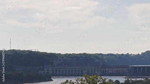 Aerial view of a large hydroelectric power plant on a wide river