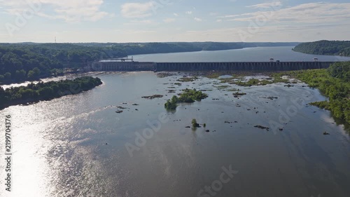 Aerial view of a large hydroelectric power plant on a wide river