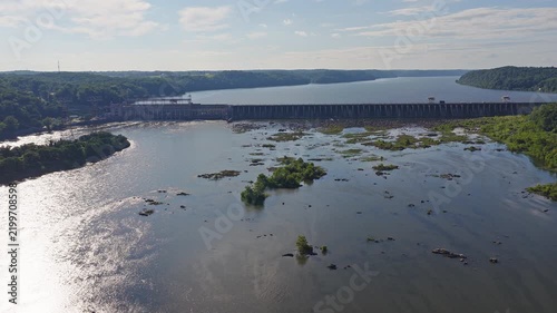 Aerial drone view of a hydroelectric power plant on a large river