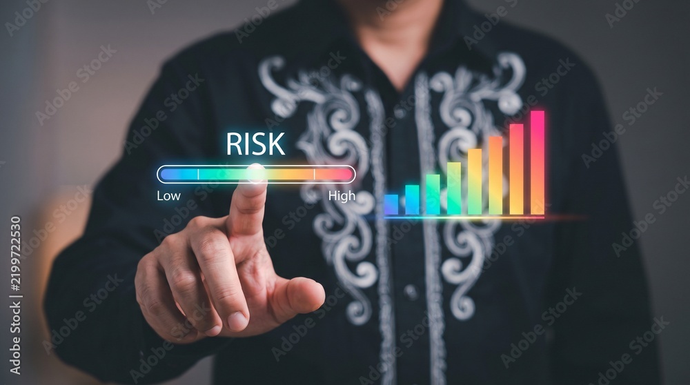 Obraz premium Person interacting with a digital risk meter and bar chart on a virtual interface