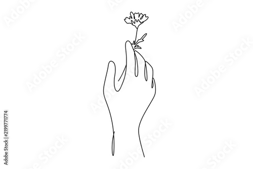 Hand holding small flower continuous line art minimalist vector