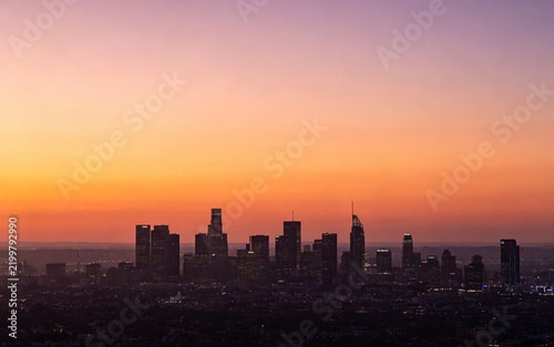 City Skyline Silhouette at Dusk, Warm Orange Purple Gradient Sky