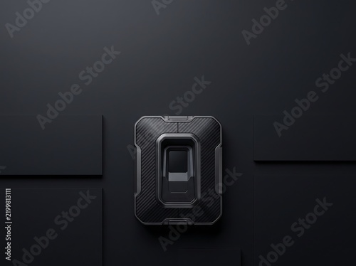 Industrial biometric fingerprint scanner mounted on black wall with access contr