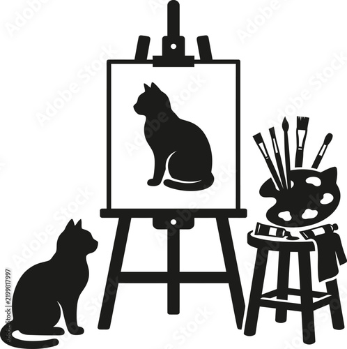 Black cat sitting next to artist easel