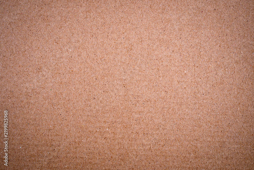 Brown kraft paper texture background, old recycled cardboard sheet surface.