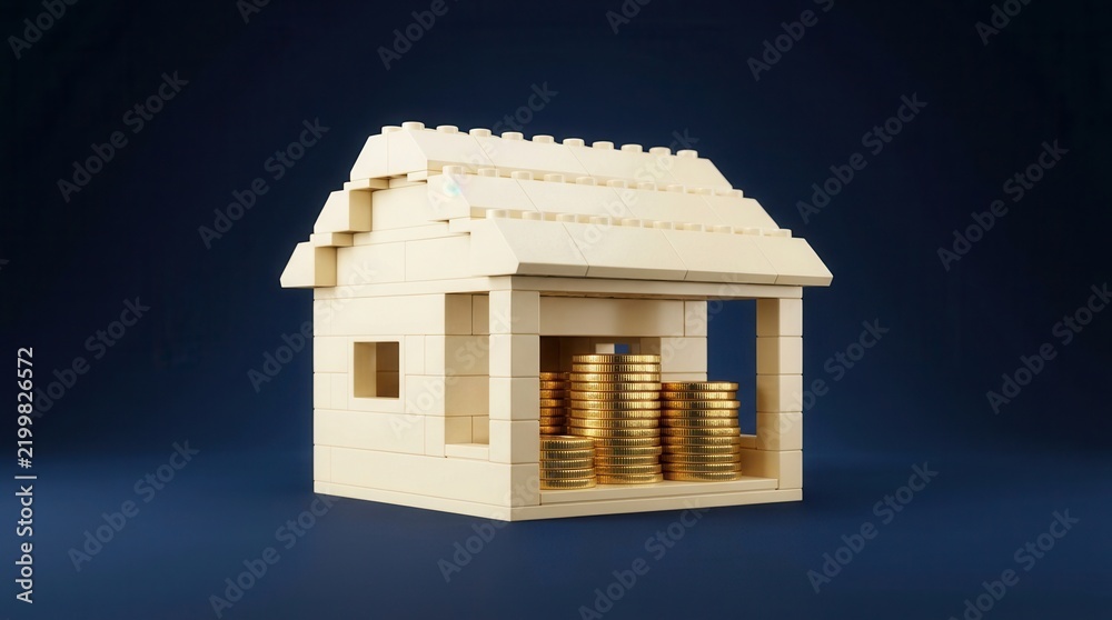 Fototapeta premium Toy brick house model with gold coins symbolizing home ownership.