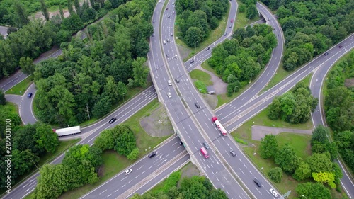 Aerial View of a Bustling Highway Interchange Showcasing Modern Transportation Infrastructure and Flowing Traffic
