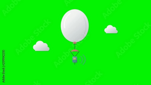 A weather balloon ascends with a suspended radiosonde. The instrument transmits measurements while nearby clouds drift at different speeds.