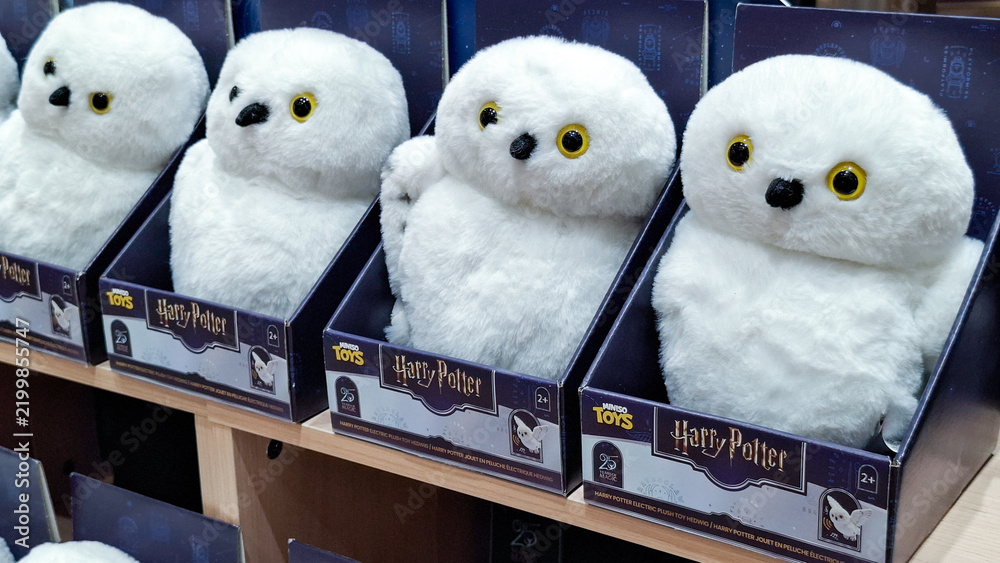 Fototapeta premium Miniso Harry Potter Hedwig electric plush toy in box packaging lined on store display shelf on September 16, 2026 in Bangkok, Thailand 