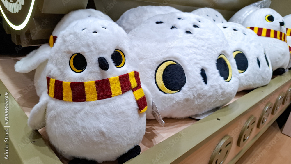Fototapeta premium Official Harry Potter Hedwig snowy owl plush doll with Gryffindor scarf on display shelf in Miniso land on September 16, 2026 in Bangkok,Thailand 