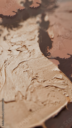 Thick beige and dark brown impasto paint background with organic stroke patterns. abstract oil painting texture, rustic interior wall finish, contemporary creative design.