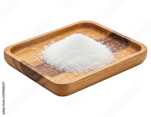 Natural white sea salt crystals on wooden tray with transparent backdrop