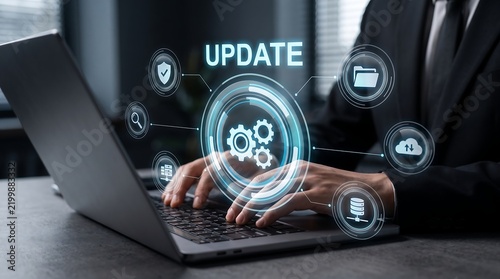 Professional Businessman Using Laptop for Software System Update Process with Futuristic Interface Icon Overlay for Technology Corporate Header Banner