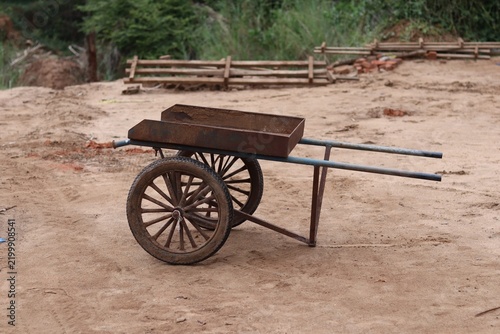 Traditional Two Wheeled Handcart for Brick Transportation at a Rural Construction Site in India.