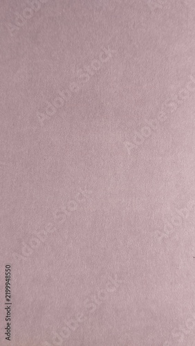 Dusty pink abstract textured background. Minimal backdrop, pastel texture, vertical wallpaper, elegant style, copy space.