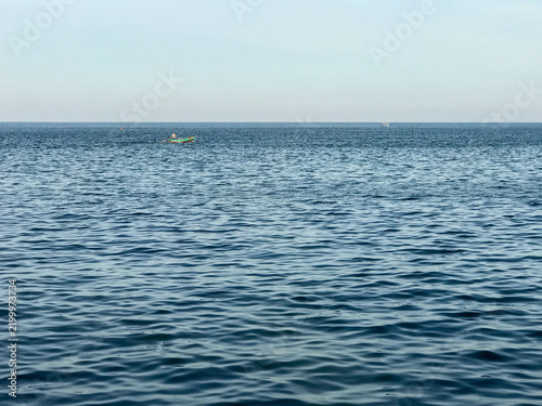 Bild auf Leinwand Blue ocean and little boat with clear sky