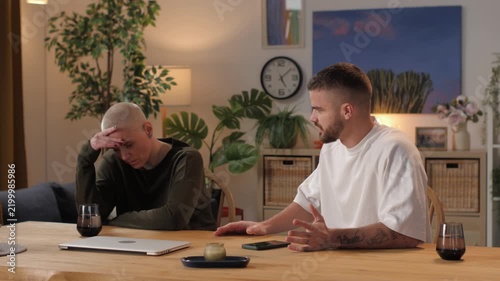 Frustrated couple arguing at home