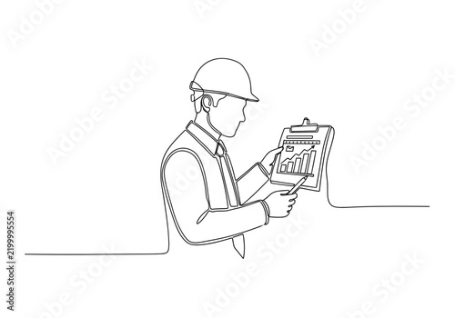 Business analyst reviewing financial chart on clipboard