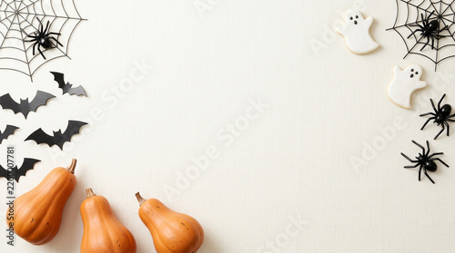 Spooky halloween background border with pumpkins bats and spiders