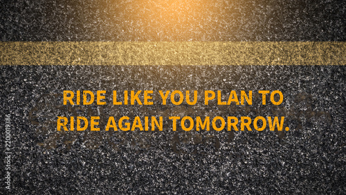 Konstfotografi Motorcycle rider safety slogan on dark asphalt road with yellow line: Ride like