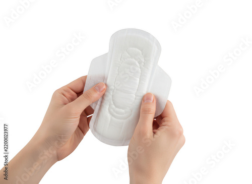 Hands holding a single white sanitary napkin, isolated on a black background, feminine hygiene product, healthcare and personal care concept isolated on a transparent background