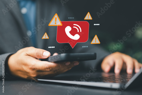 Scam Call Warning on Smartphone Screen Shows Cybersecurity Threat From Fraudulent Callers, With Red Alert Icons Representing Mobile Spam, Robocall, and Phone Based Phishing Attacks
