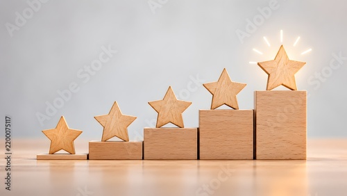 Five wooden stars placed on ascending blocks culminating in a glowing top star representing excellent customer feedback top rating and business success.