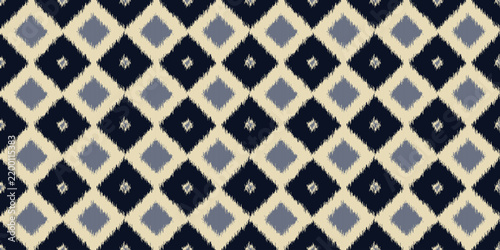 Seamless ikat pattern with navy blue and beige diamond rhombus, ethnic vector background
