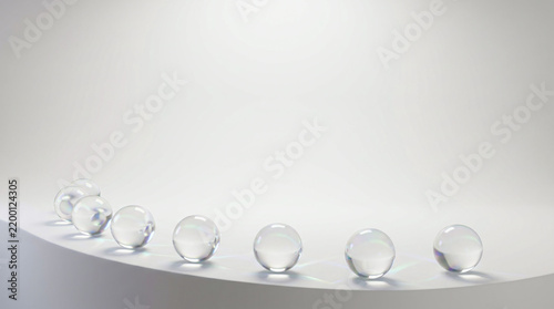 Transparent Glasslike Spheres Along a Curved White Platform Against Pale Background